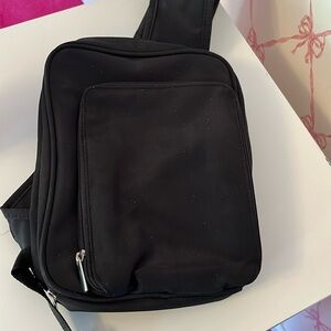 Black vinyl Crossbody purse.